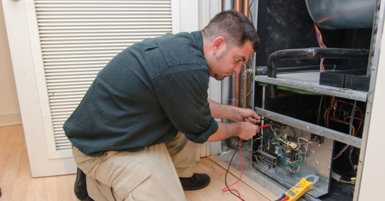 technician working on heating system